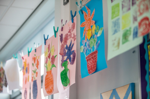 Collage flowers hanging in a classroom